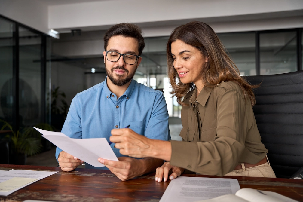 couplel ooking at documents