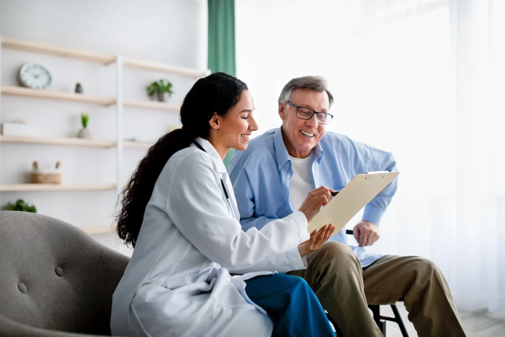 senior man talking with doctor